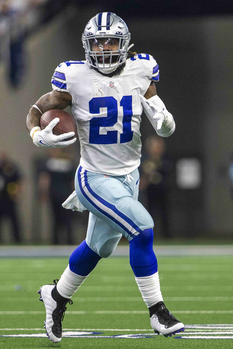 Dallas Cowboys running back Ezekiel Elliott (21) runs with the football during the first quarte ...