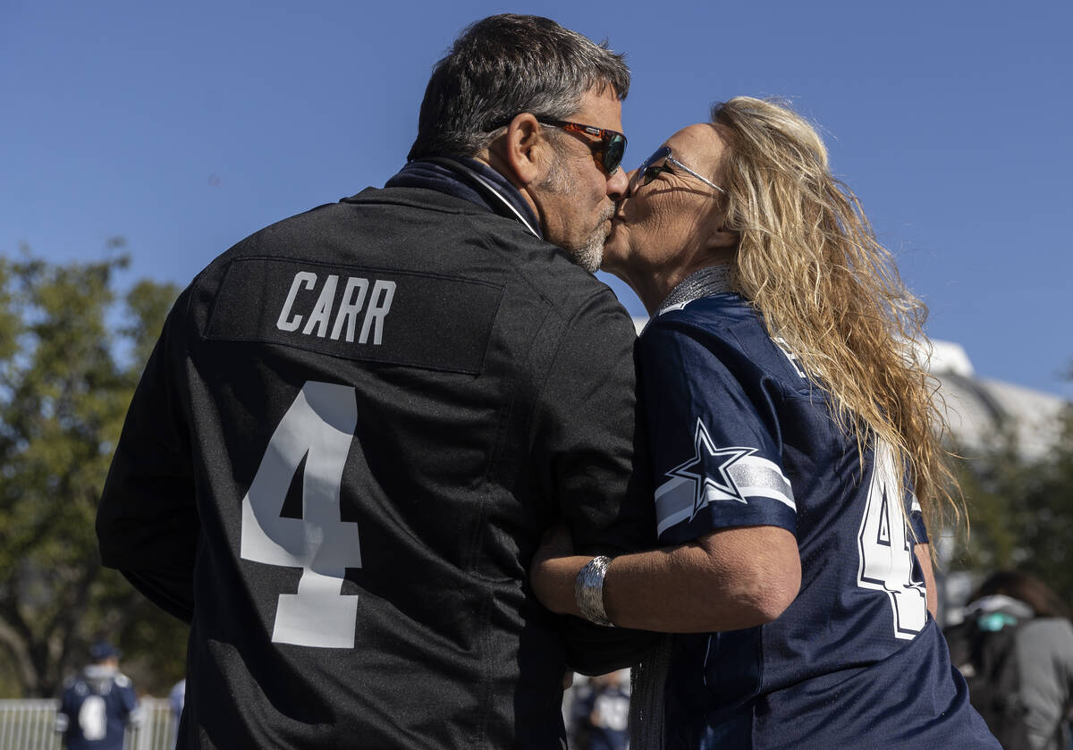 Mark Gabriel, left, and Gloria Batson before the start of an NFL football game between the Raid ...