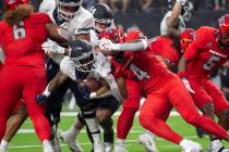 Utah State Aggies running back Calvin Tyler Jr. (4) collides with UNLV Rebels linebacker Jacoby ...