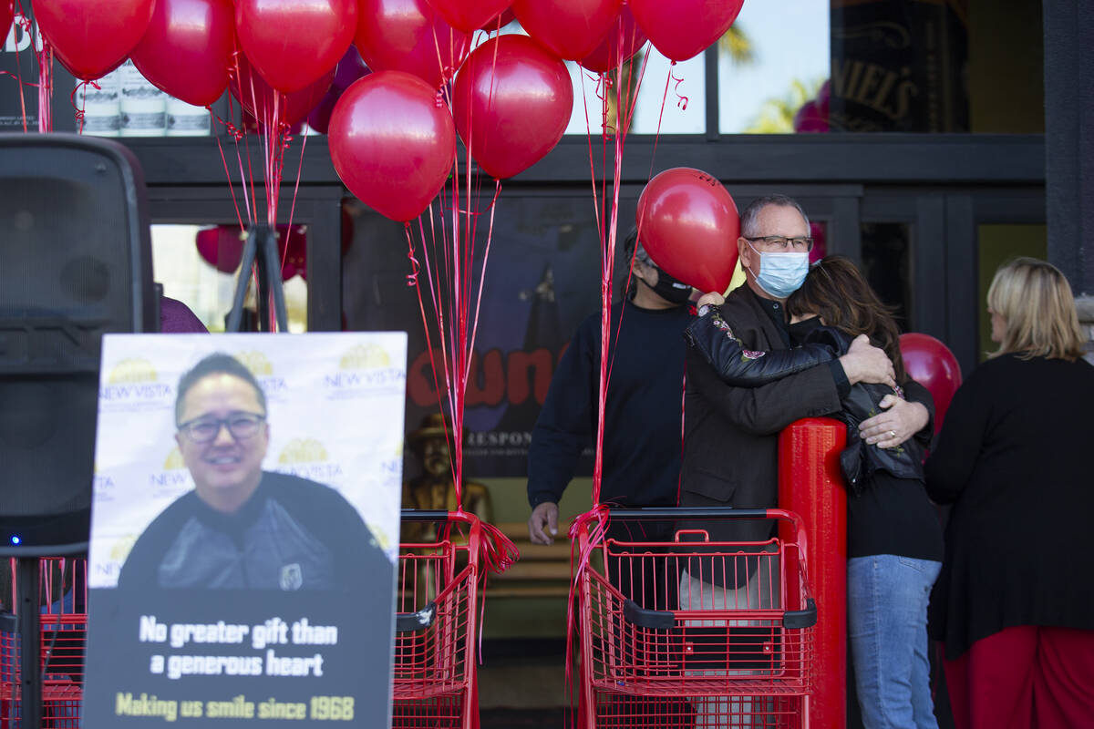 Family, friends and members of the public attend a vigil to the late Kenny Lee, the heir to Lee ...