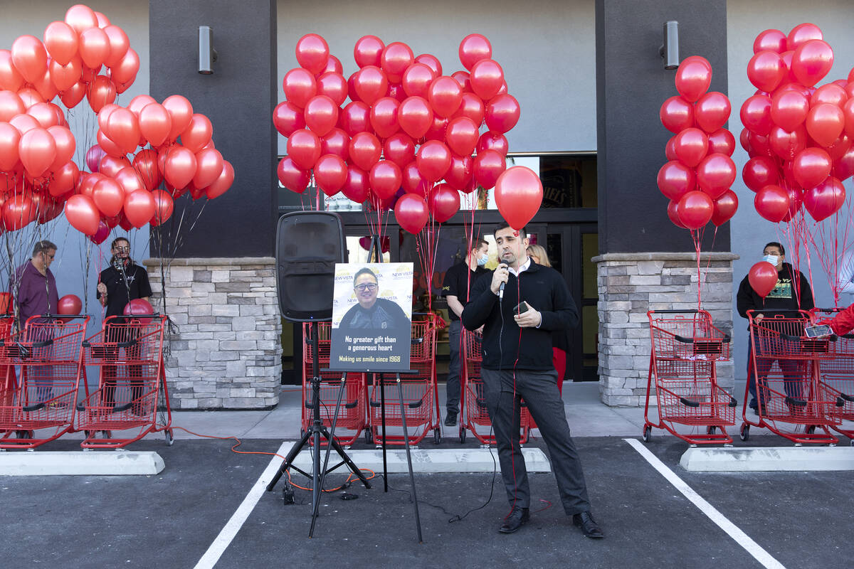 Ron Principio, a Leeճ Discount Liquor executive, speaks during a vigil to the late Kenny ...