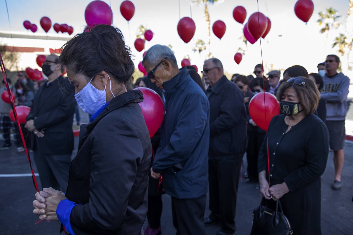 Michelle Goodale, a longtime friend of Kenny Leeճ, participates in a moment of silence du ...