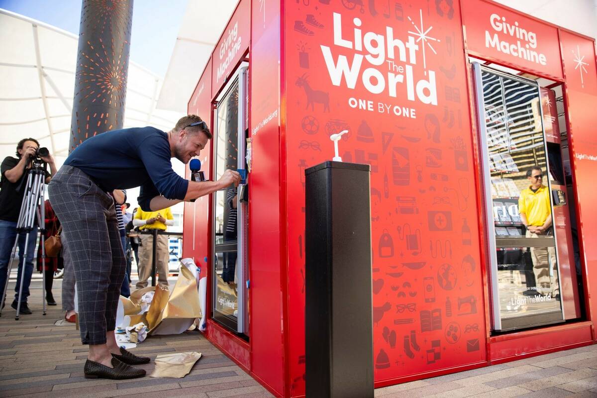 Dan Reynolds of Imagine Dragons donates using the "giving machine," a vending machine that allo ...