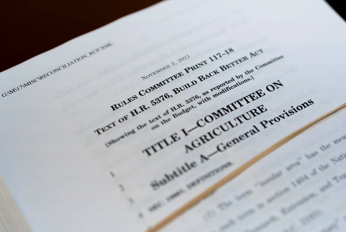 A copy of H.R.5376, the Build Back Better Act, is seen as the House Rules Committee begins work ...