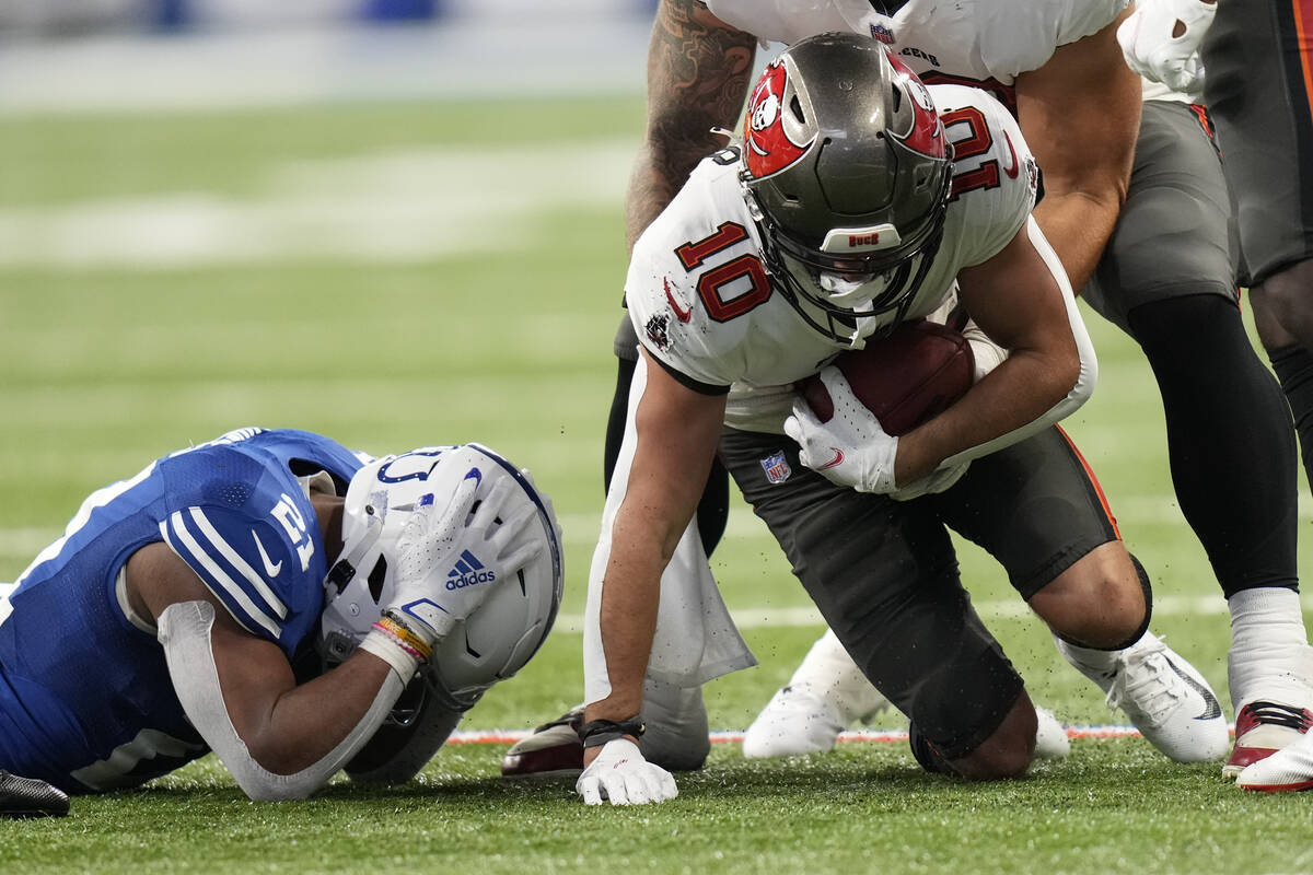 Tampa Bay Buccaneers' Scott Miller (10) recovers a fumble by Indianapolis Colts' Nyheim Hines ( ...