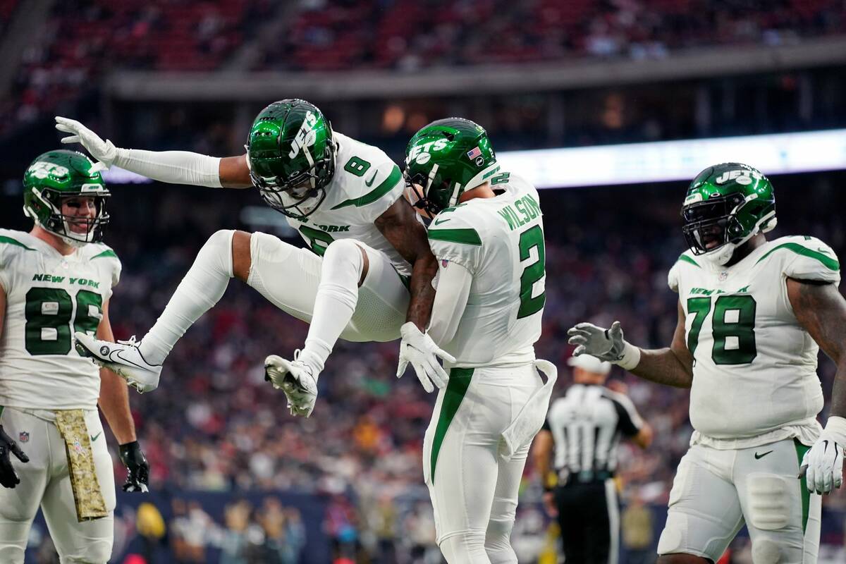 New York Jets quarterback Zach Wilson (2) celebrates his touchdown with quarterback Josh Johnso ...