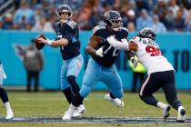 Tennessee Titans quarterback Ryan Tannehill (17) looks for a receiver as offensive guard Rodger ...