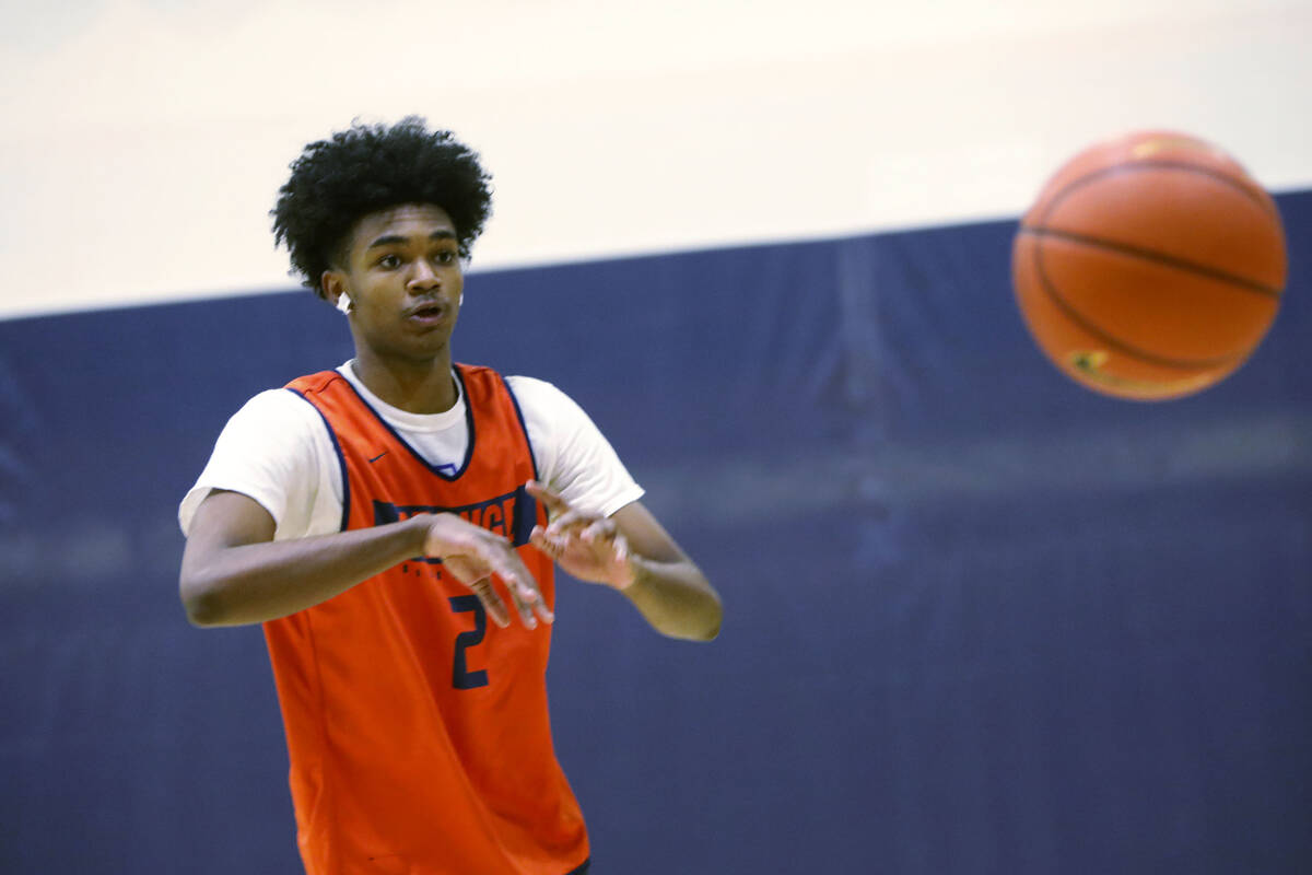 Keenan Bey passes the ball during a basketball practice at Bishop Gorman High School, Friday, N ...