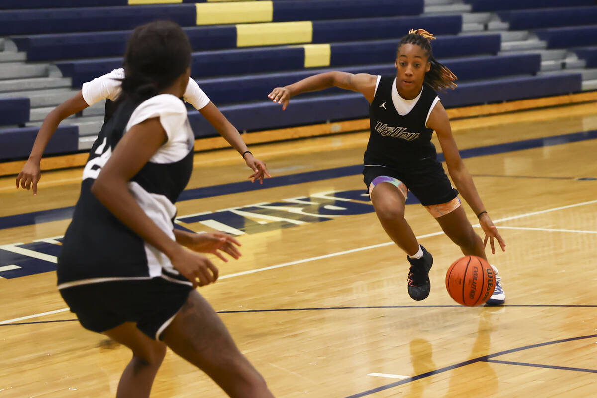 Spring Valley's Aaliyah Gayles, right, drives to the basket during practice at Spring Valley Hi ...