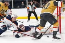 Edmonton Oilers defenseman Kris Russell (6) and Edmonton Oilers goaltender Mikko Koskinen (19) ...