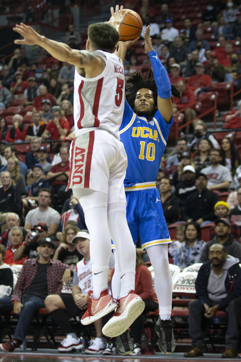 UCLA Bruins guard Tyger Campbell (10) shoots against UNLV Rebels guard Jordan McCabe (5) during ...