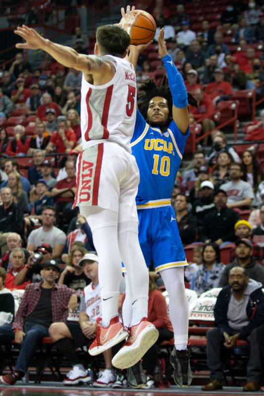 UCLA Bruins guard Tyger Campbell (10) shoots against UNLV Rebels guard Jordan McCabe (5) during ...