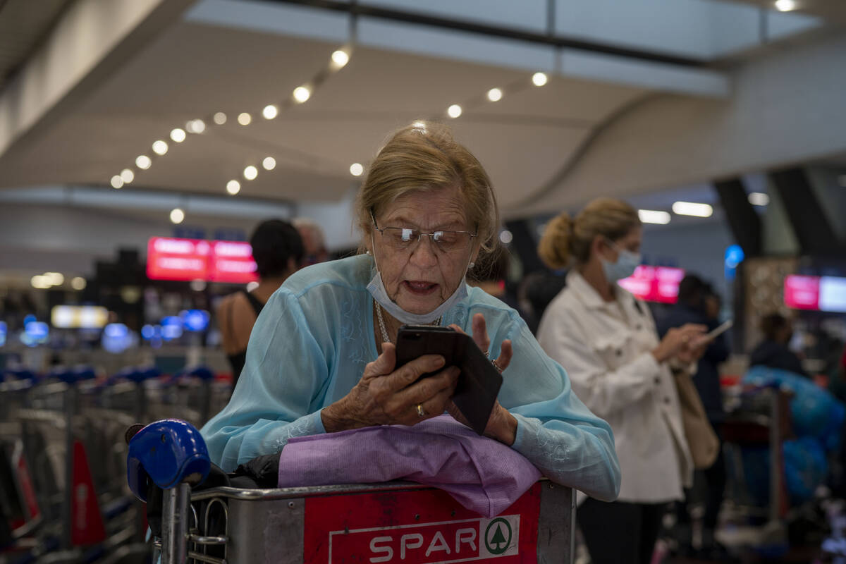 People lineup to get on the Air France flight to Paris at OR Tambo's airport in Johannesburg, S ...