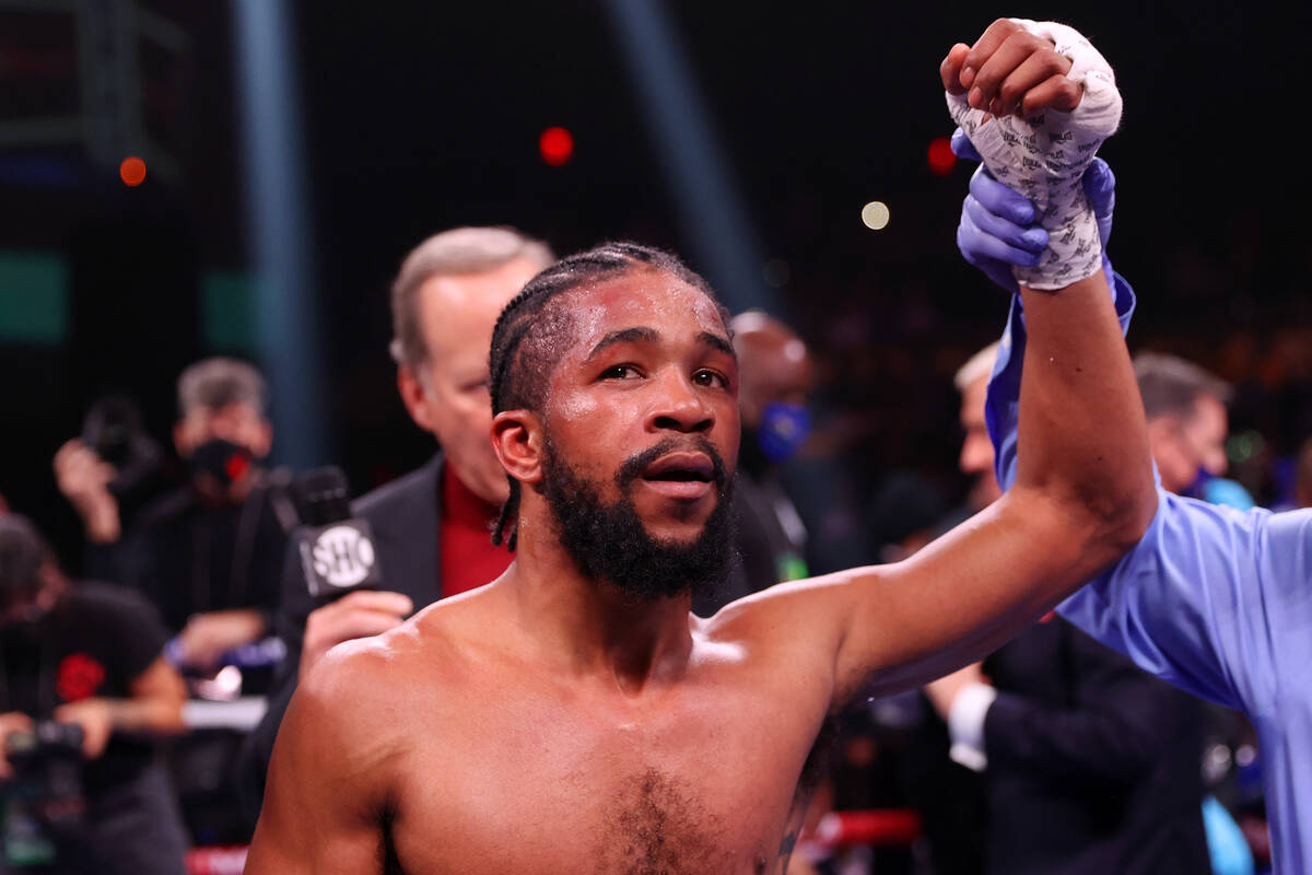 Gary Antonio Russell raises his hand in victory after his majority decision win against Alexand ...