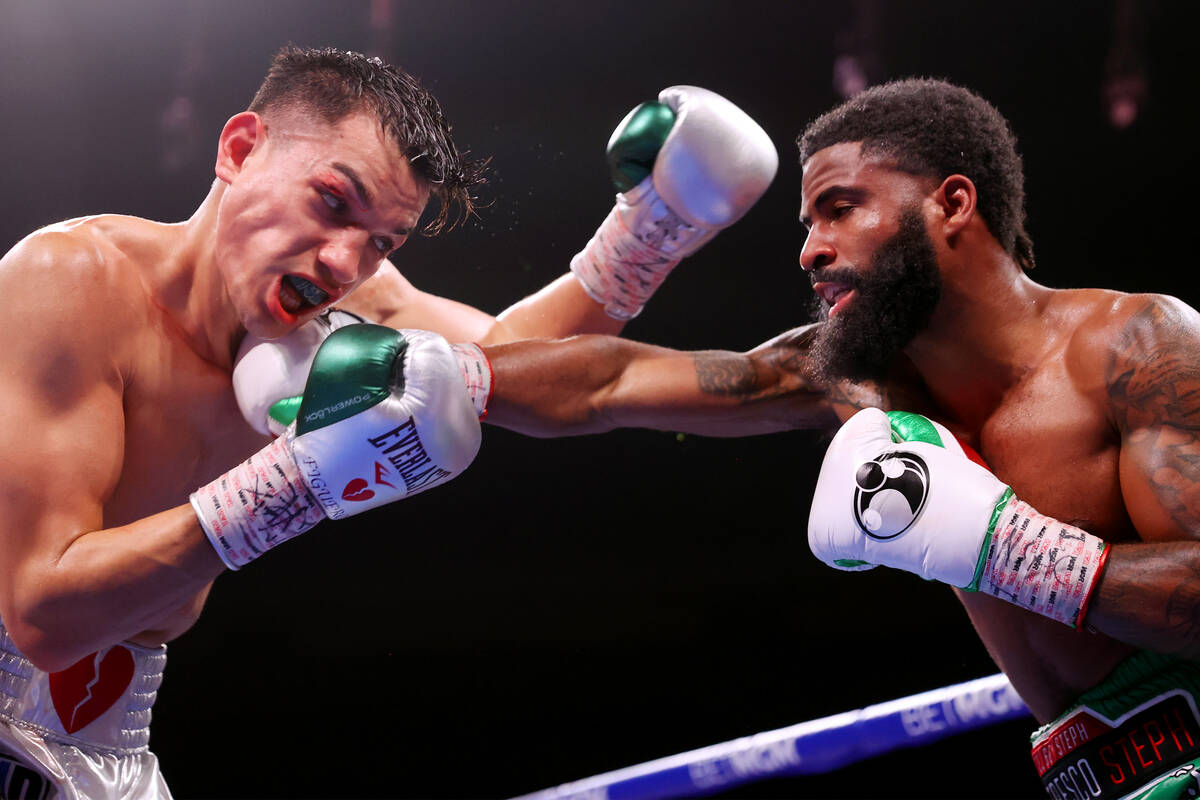 Brandon Figueroa, left, battles Stephen Fulton in the super bantamweight world champion fight a ...