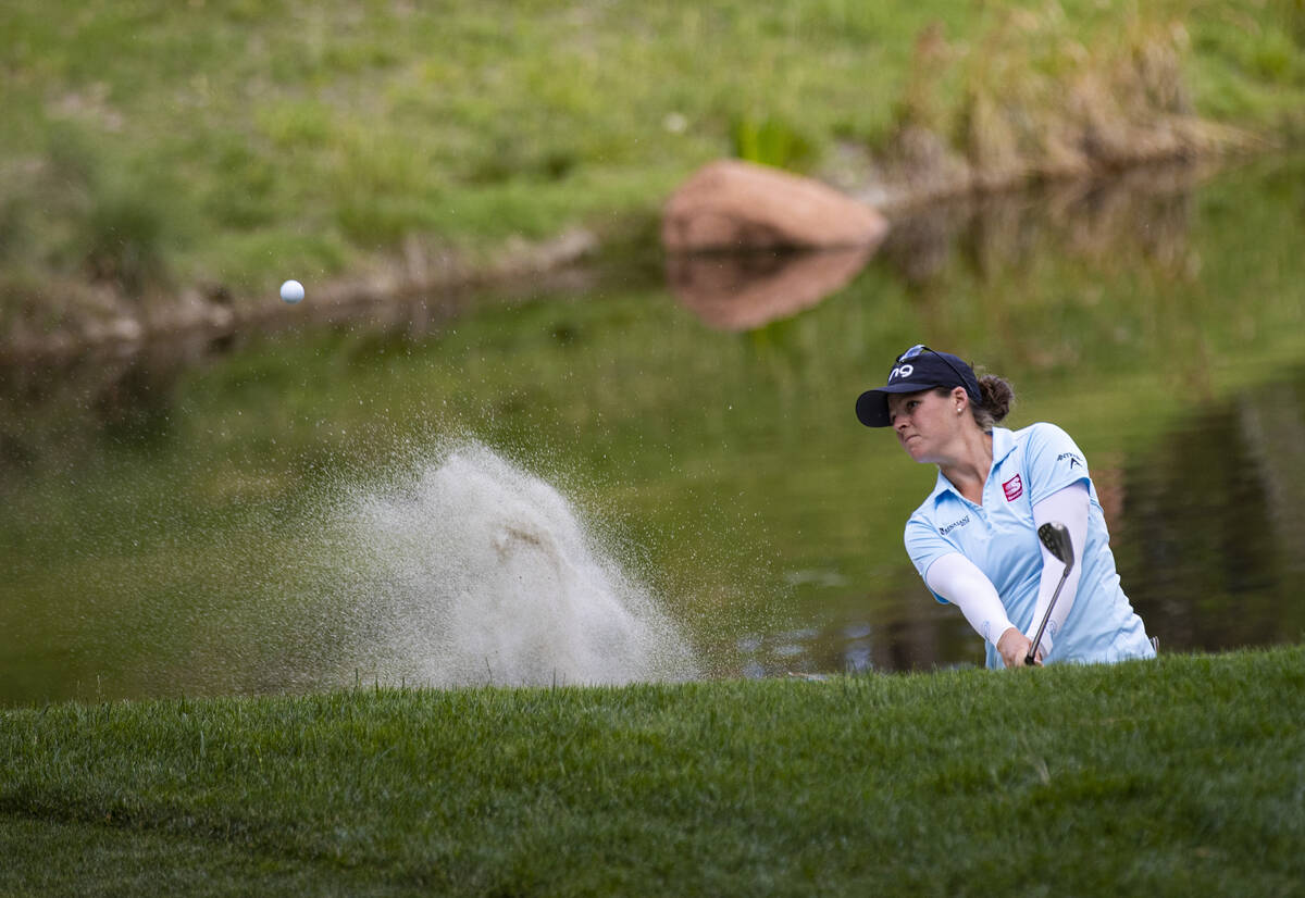 Ally Ewing hits out of the bunker at the 17th hole during the championship round of the Bank of ...