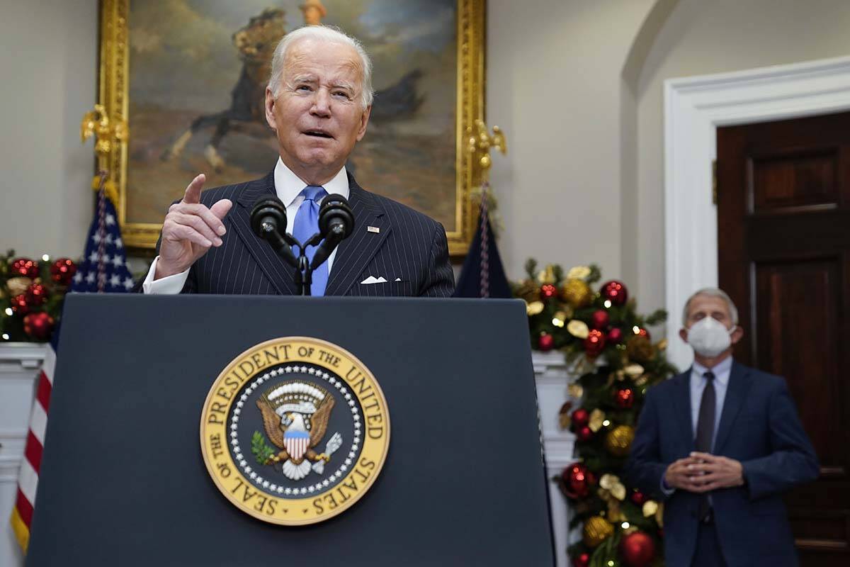 President Joe Biden speaks about the COVID-19 variant named omicron, in the Roosevelt Room of t ...