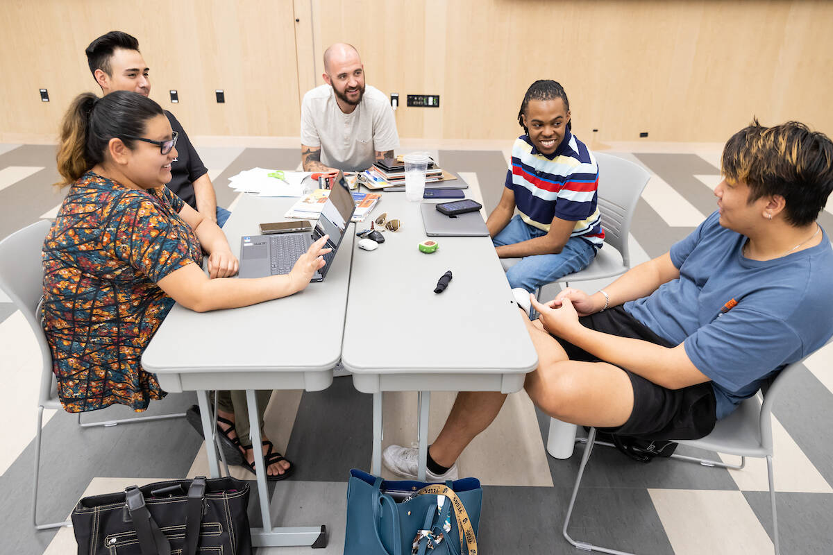 UNLV Associate Professor Joseph Morgan meets with undergraduate students doing their student te ...