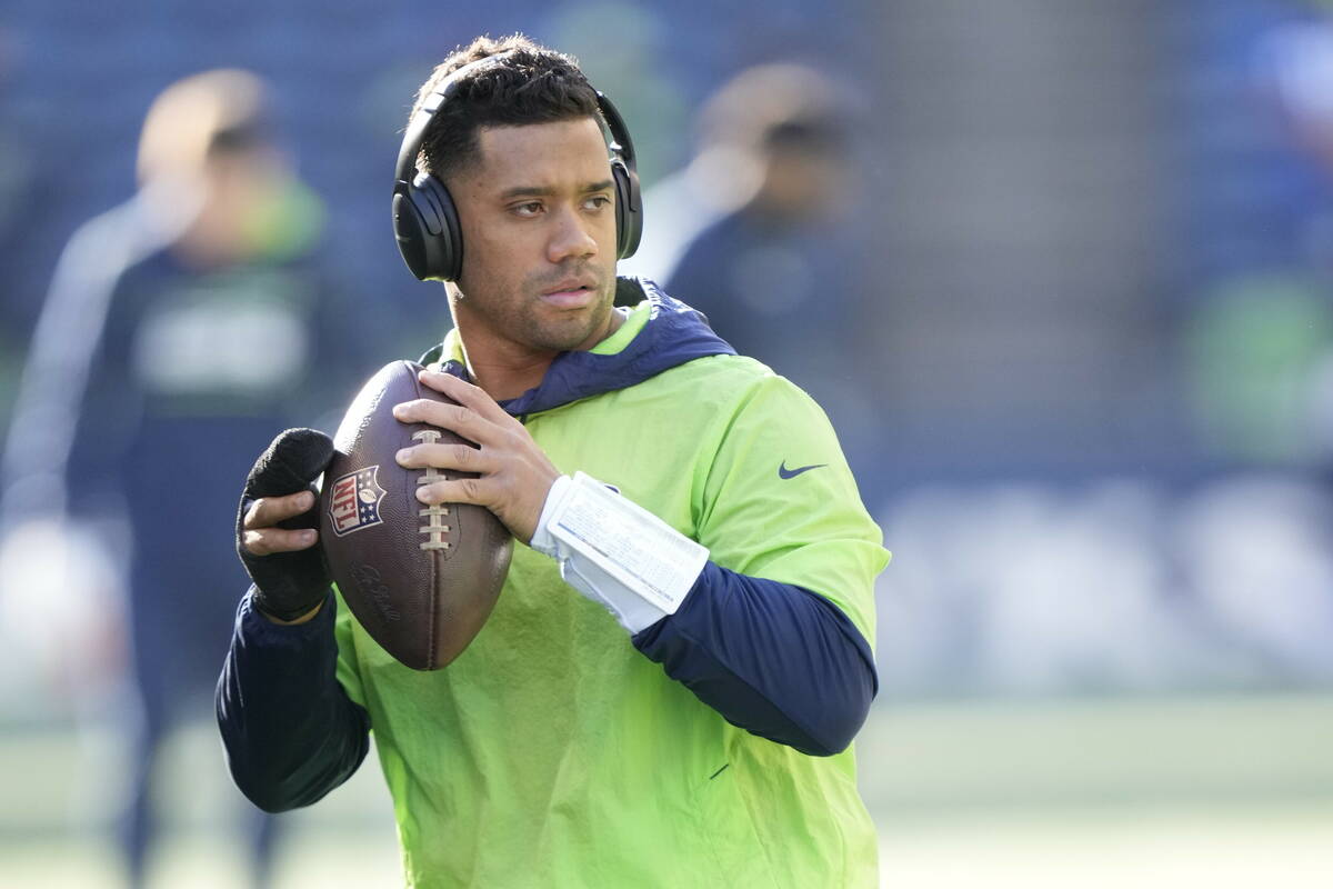 Seattle Seahawks quarterback Russell Wilson warms up before an NFL football game against the Ja ...