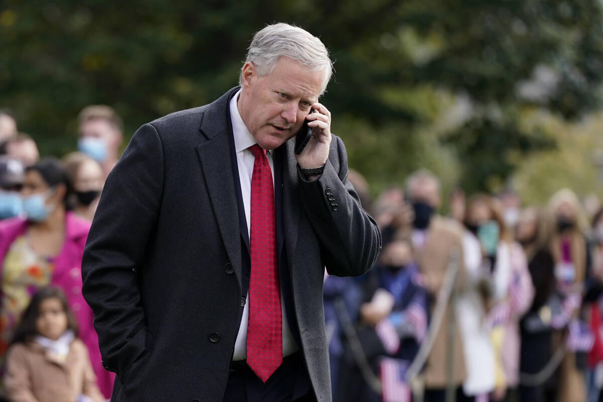 White House chief of staff Mark Meadows speaks on a phone on the South Lawn of the White House ...