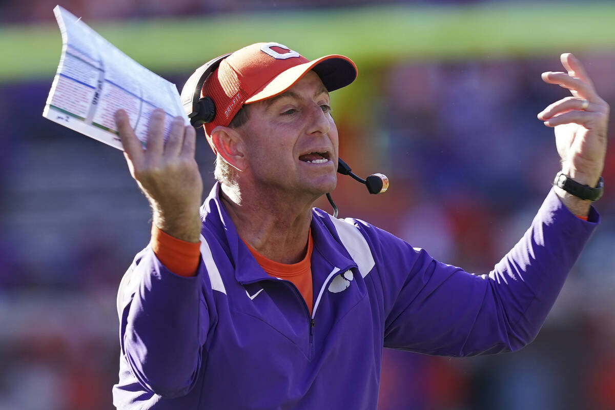 Clemson head coach Dabo Swinney yells towards the players in the second half of an NCAA college ...