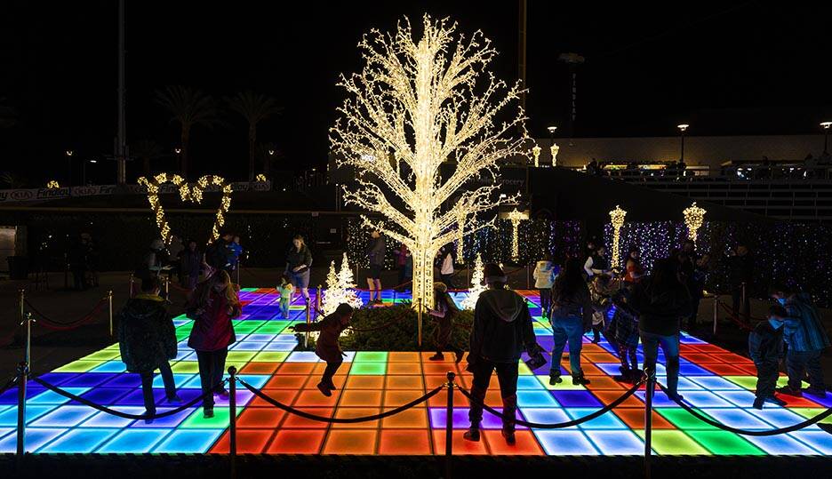Attendees explore Enchant Christmas at Las Vegas Ballpark on Tuesday, Nov. 30, 2021, in Las Veg ...