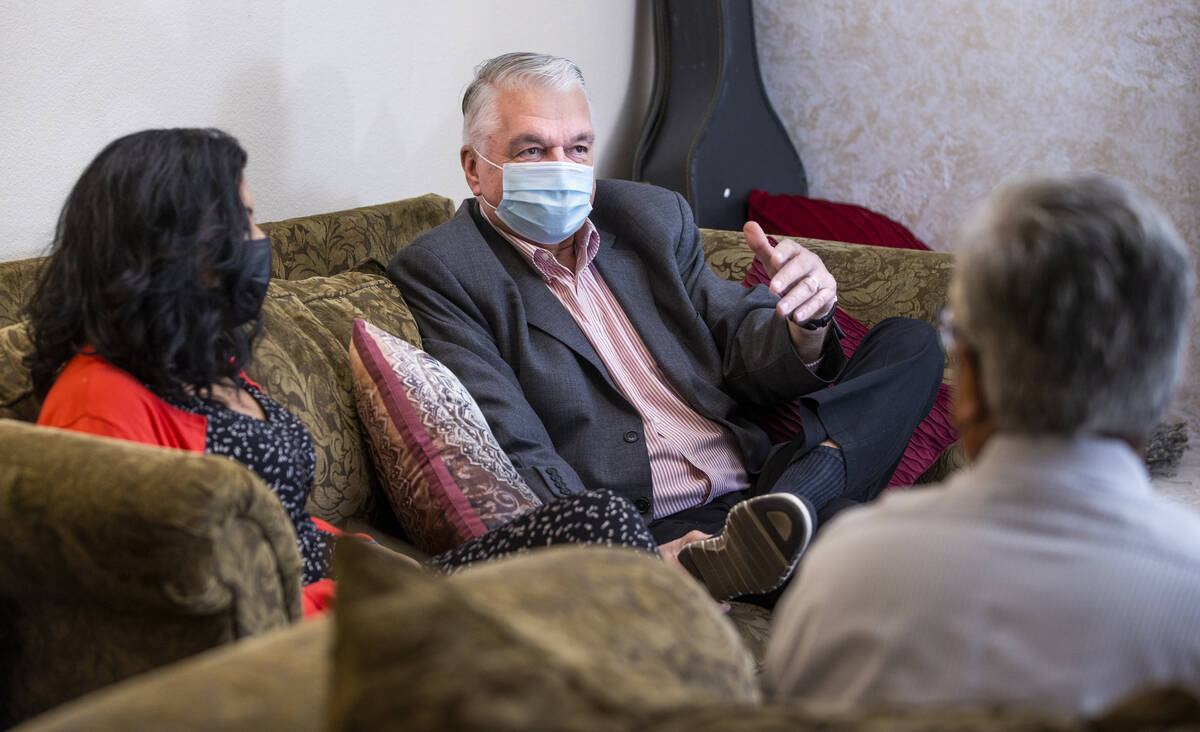 Gov. Steve Sisolak, center, talks about the impact of COVID-19 with nurse practitioner Geoconda ...