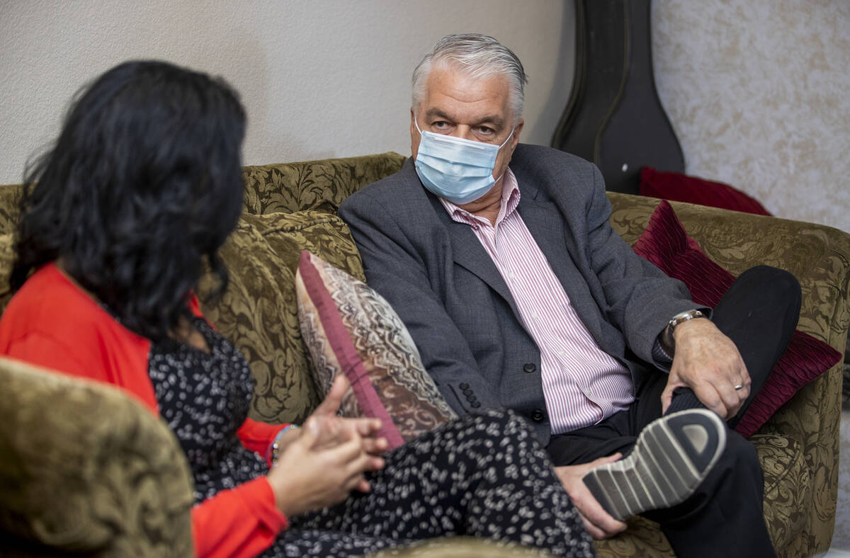 Gov. Steve Sisolak, right, talks about the impact of COVID-19 at work with nurse practitioner G ...