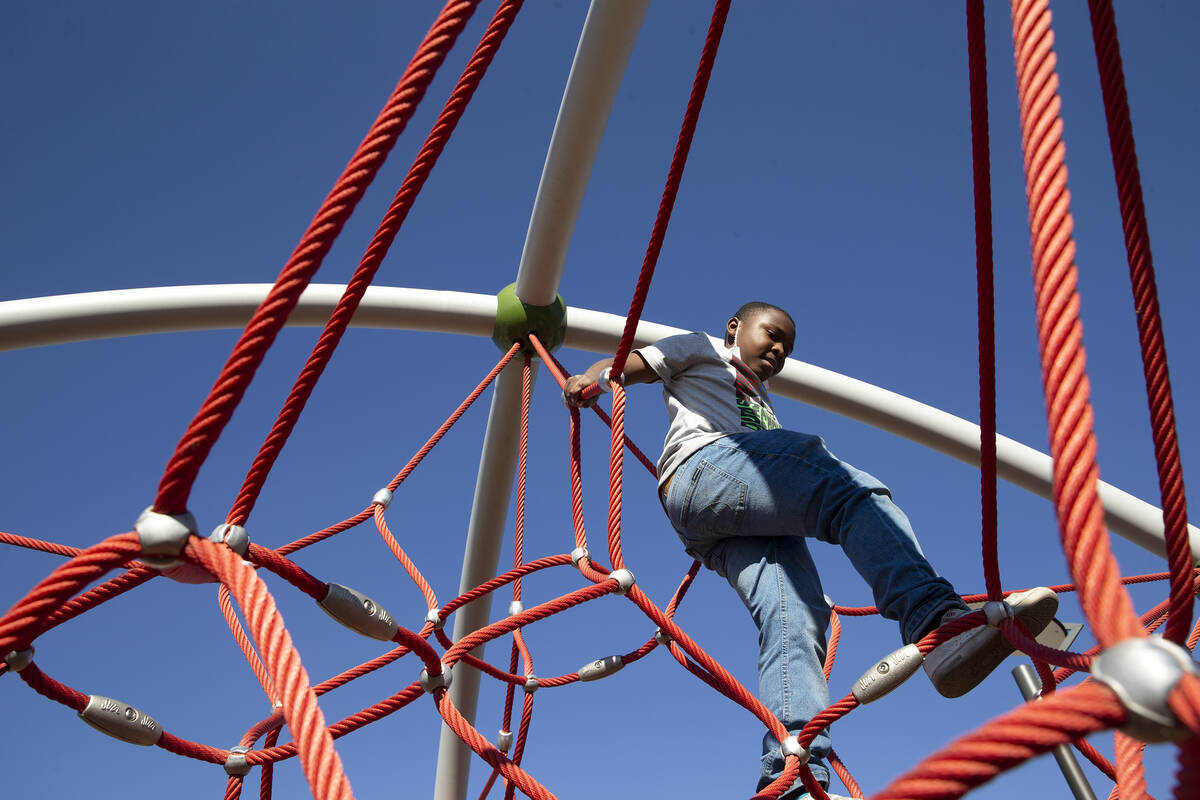 Jamir Harold, 8, climbs on the play structure at the new Historic Westside Legacy Park on Satur ...