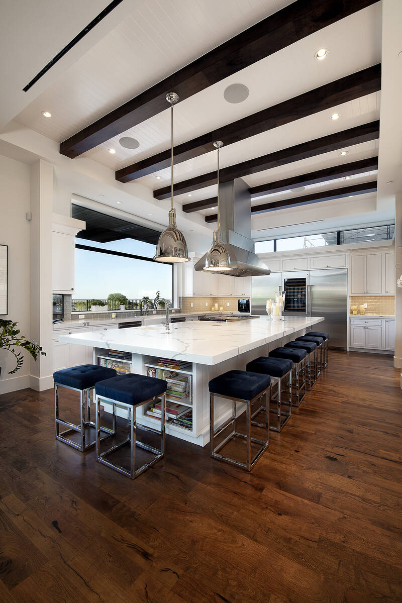 Larger kitchen islands are trending in the luxury market. These expansive islands are completed ...