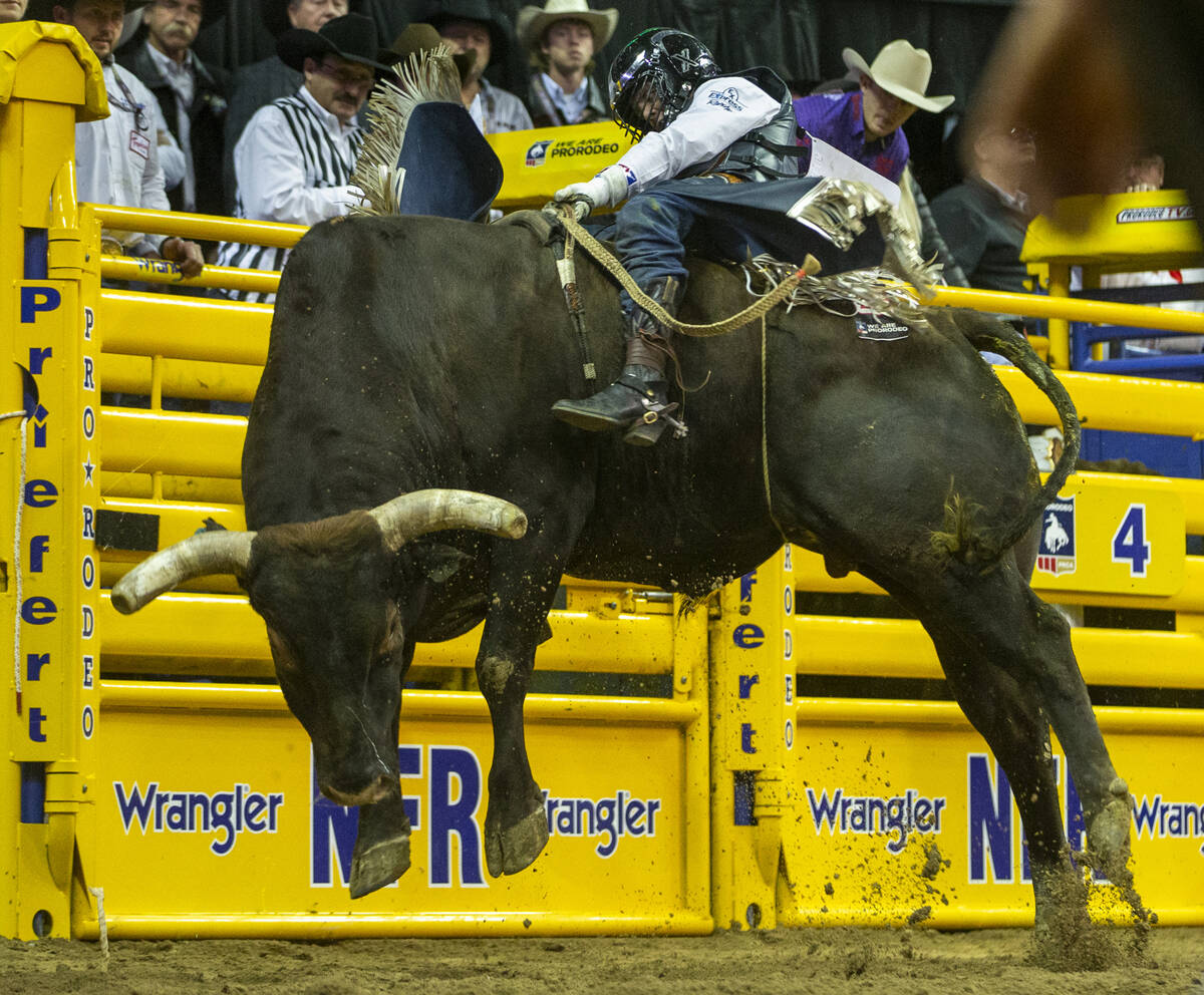 Stetson Wright of Milford, Utah, briefly rides Pickup Man in Bull Riding during the tenth go ro ...