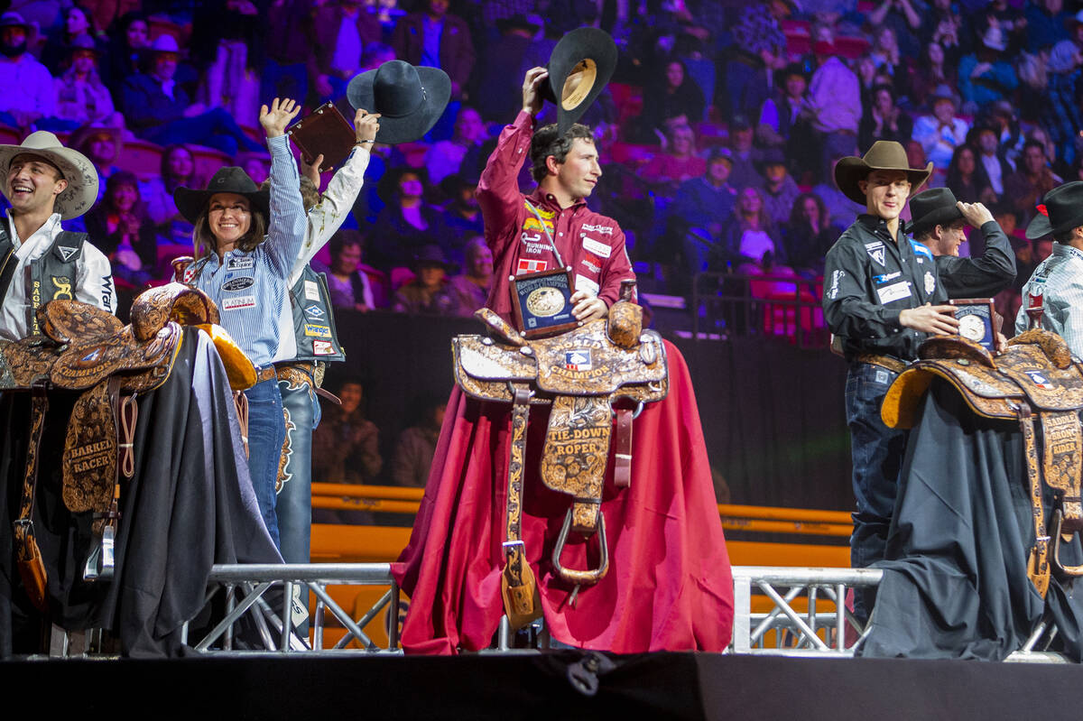 All-Around World Champion Stetson Wright of Milford, Utah, center left, stands with All-Around ...