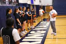 Spring Valley coach Billy Hemberger, right, talks with his players during basketball practice a ...