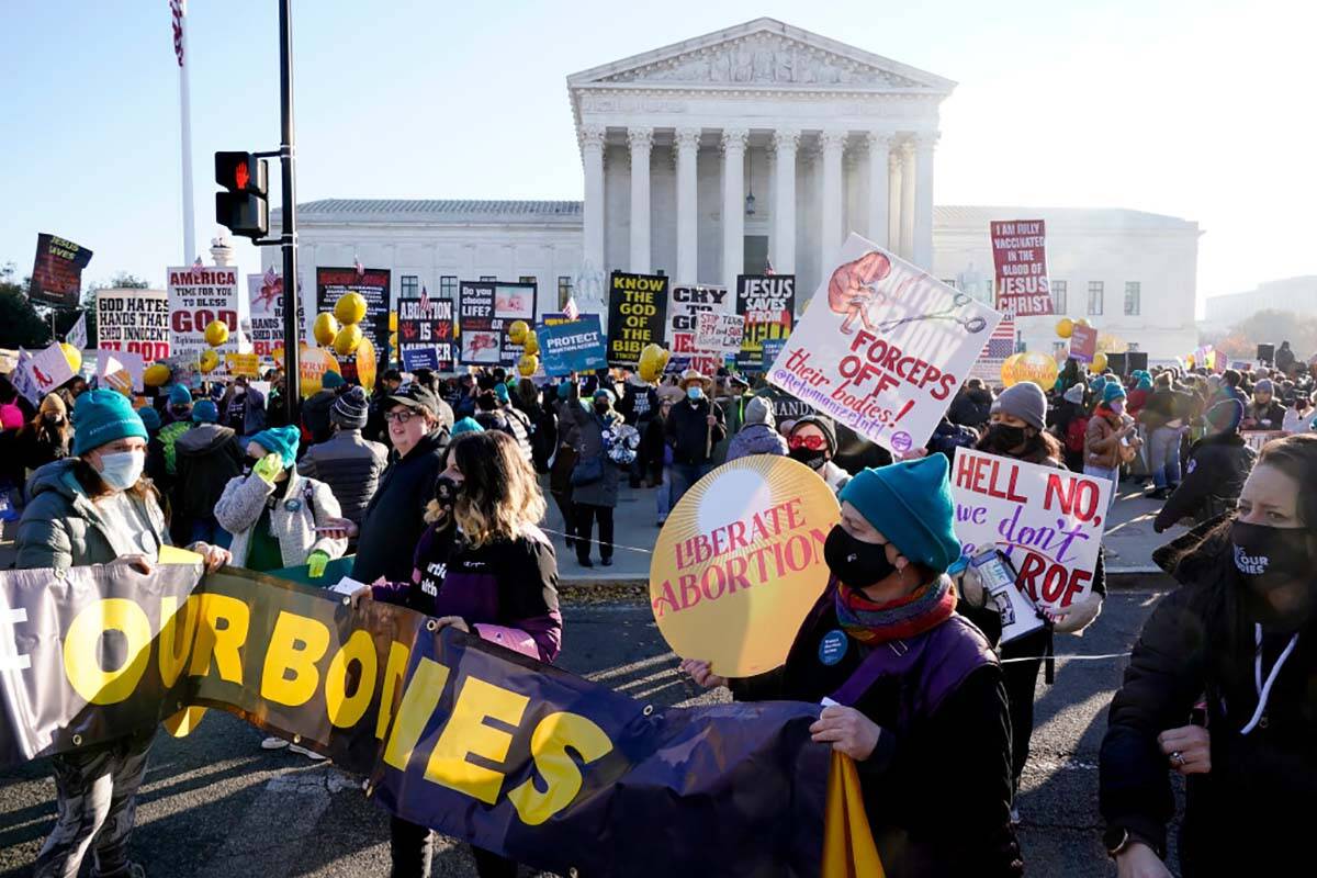 Abortion rights advocates and anti-abortion protesters demonstrate in front of the U.S. Supreme ...