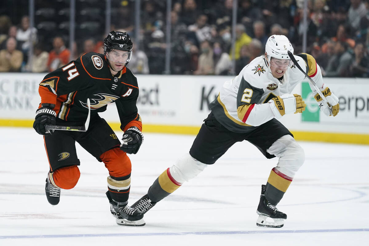 Anaheim Ducks' Adam Henrique, left, and Vegas Golden Knights' Zach Whitecloud skate after the p ...