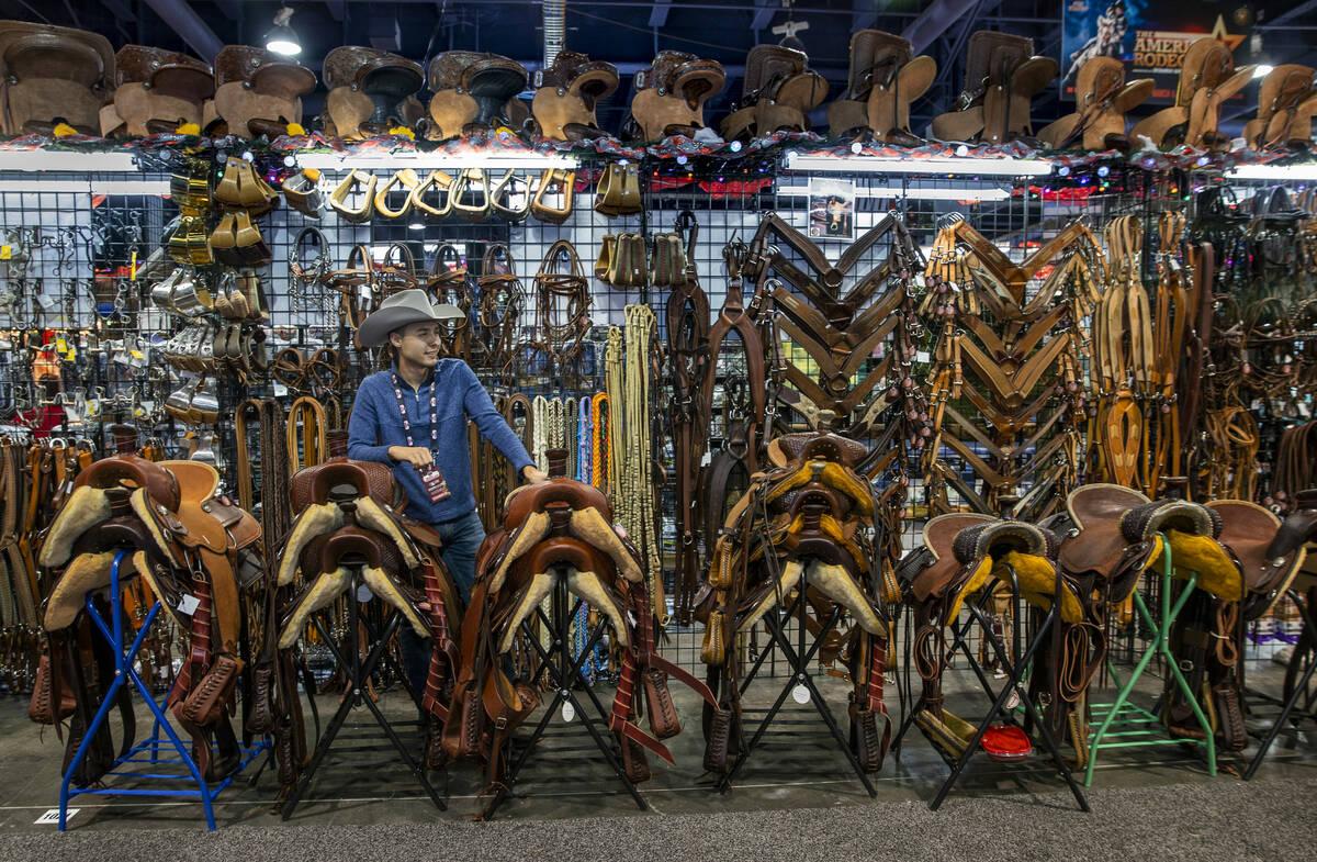 Frankie Justin with Circle L Saddle of Texas patiently waits for customers during the opening n ...