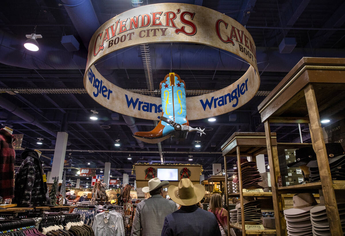Shoppers check out some of the merchandise from CavnenderÕs Boot city during the opening n ...