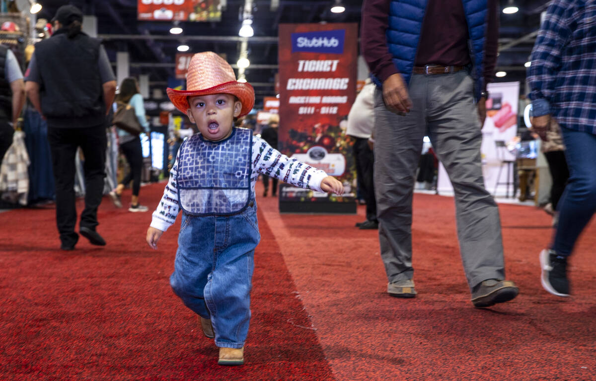 Fabian Mauricio, 1, of Little Rock, CA., wanders along with family during the opening night of ...