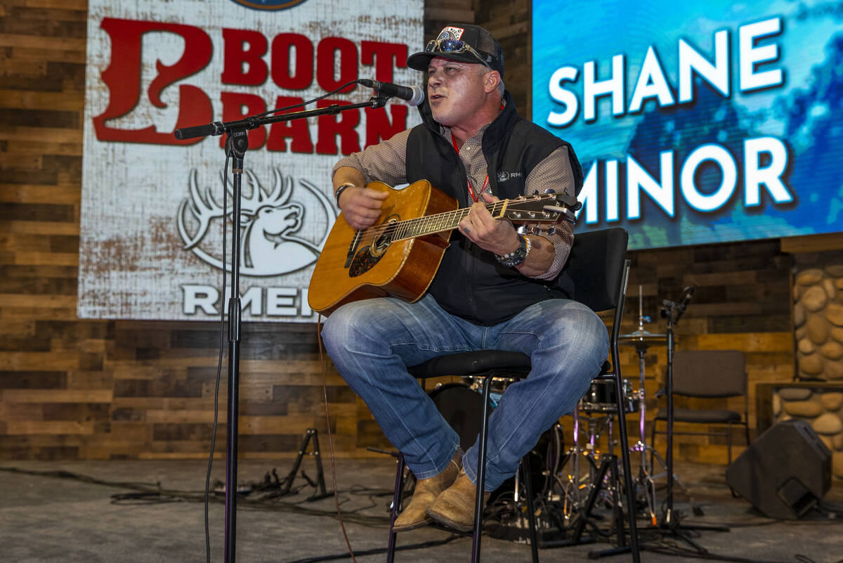 Musician Shane Minor entertains a small crowd on the Ariat Rodeo Live Stage during the Cowboy C ...