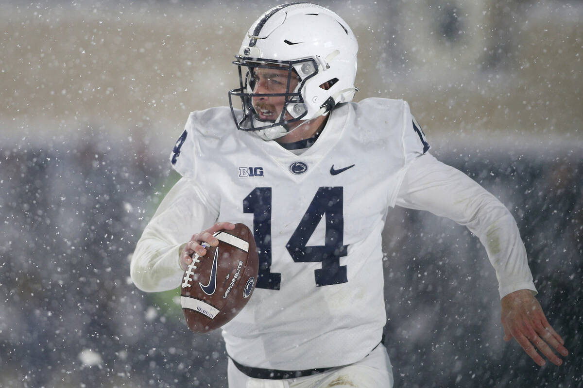 Penn State quarterback Sean Clifford scrambles during the fourth quarter of an NCAA college foo ...