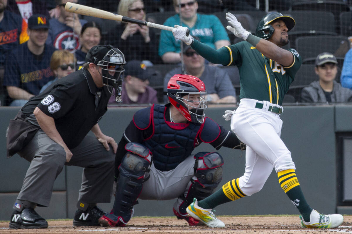 Oakland Athletics second baseman Tony Kemp (5) drives a ball to right field in the second innin ...