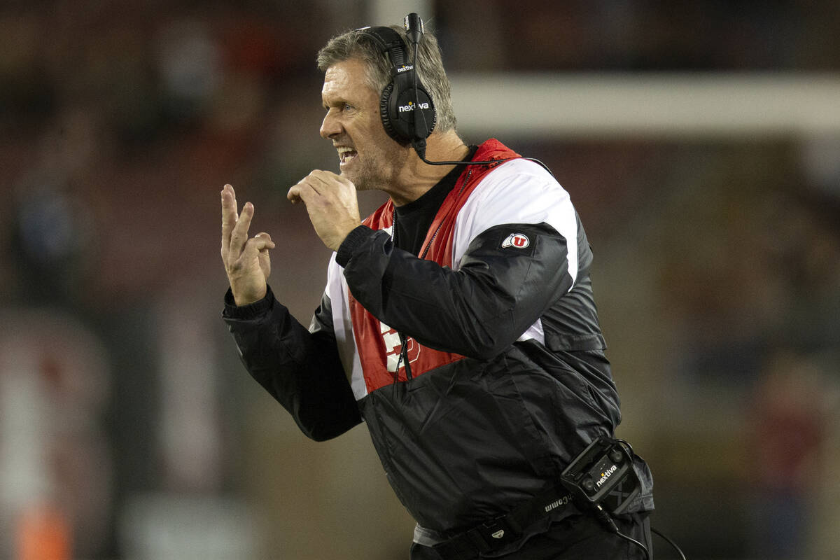 Utah head coach Kyle Whittingham signals a play to his team during the second quarter of an NCA ...