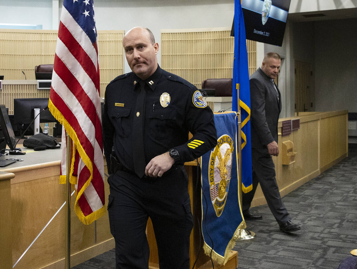 Henderson Police Captain Jonathan Boucher, left, and Detective Joseph Ebert leave the podium af ...