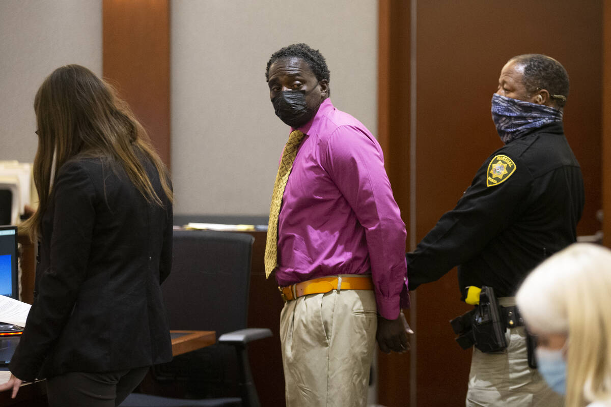 Leroy Mack, who shot his ex-girlfriend Rayven Thomas, looks back at her after being sentenced i ...