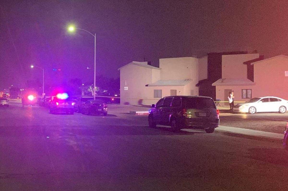 Police investigate a homicide near East Owens Avenue and North Sandhill Road in Las Vegas on Tu ...