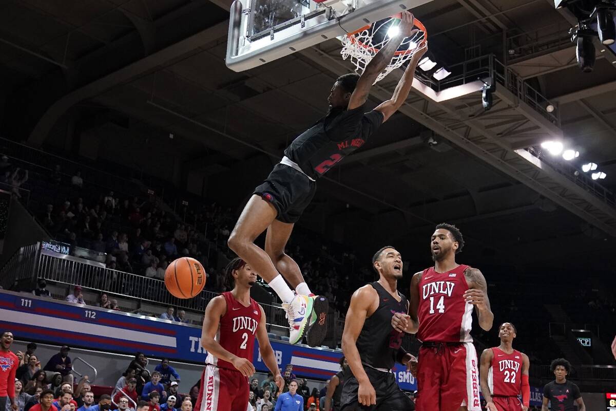 SMU guard Michael Weathers dunks and forward Tristan Clark (25) celebrates as UNLV 's Justin We ...