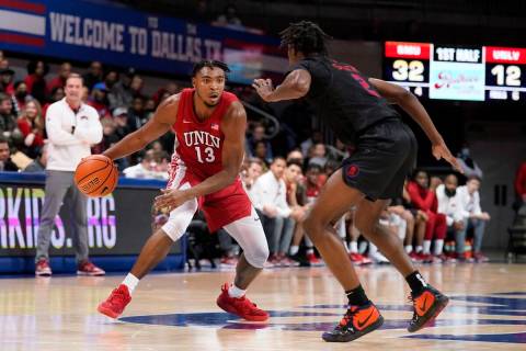 UNLV guard Bryce Hamilton (13) works for an opening to the basket against SMU guard Jalen Smith ...