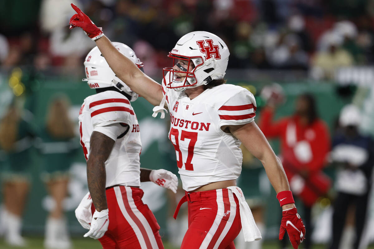Houston Cougars wide receiver Jake Herslow gestures after scoring against South Florida during ...