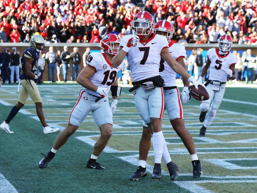 Georgia wide receiver Jermaine Burton celebrates his touchdown reception against Georgia Tech d ...