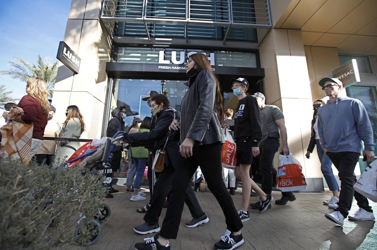 Black Friday shoppers walk through Downtown Summerlin, Friday, Nov. 26, 2021, in Las Vegas. (Ch ...